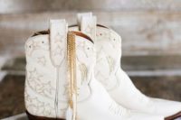 11 white cowboy booties with embroidered stars are a nice idea for a cowboy or a boho bride