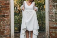 12 white leather booties paired with a modern plain wedding dress with sheer sleeves for a trendy look