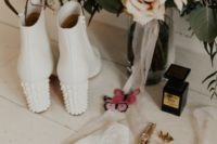 14 white leather boots with heels decorated with white pearls for a catchy and trendy touch