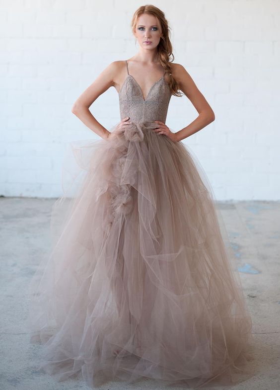 a lavender colored wedding ballgown with an embroidered bodice, spaghetti straps and a tiered tulle skirt