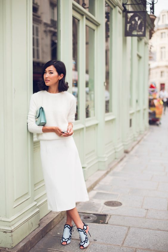 a white long sleeve top, a white midi skirt, laser cut shoes, a mint bag for a stylish look at your bridal shower