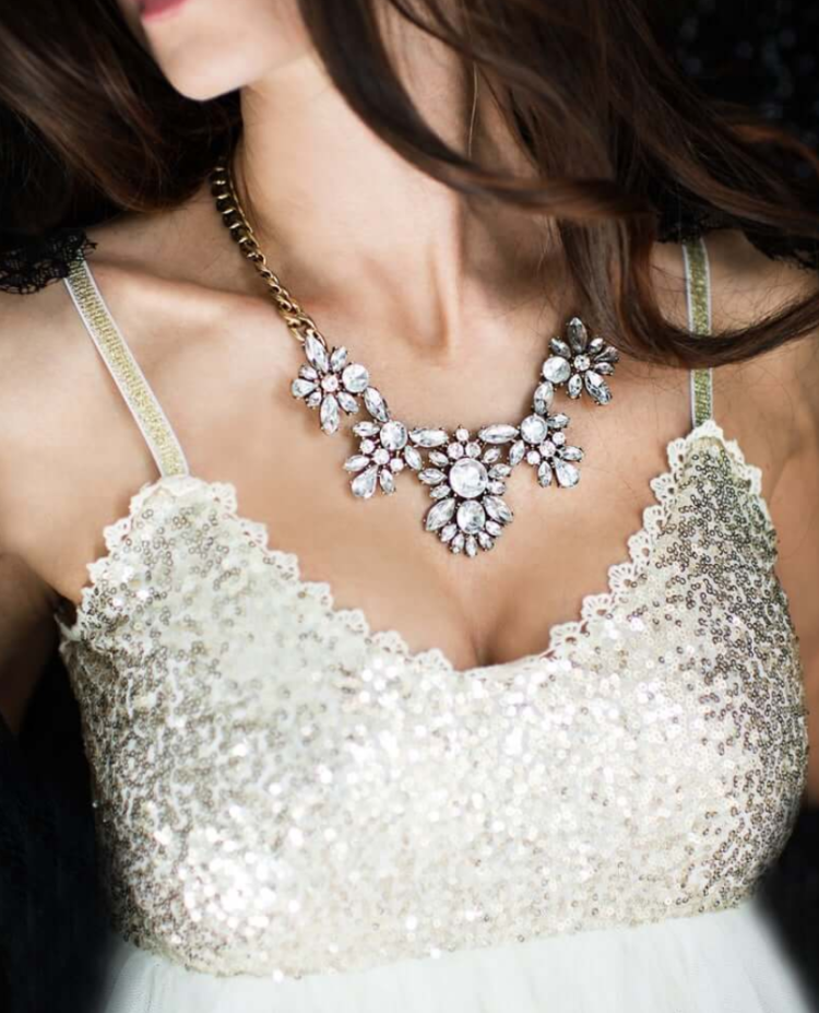 a statement vintage gold necklace with rhinestone flowers is a bold accessory for a bride with a vintage feel