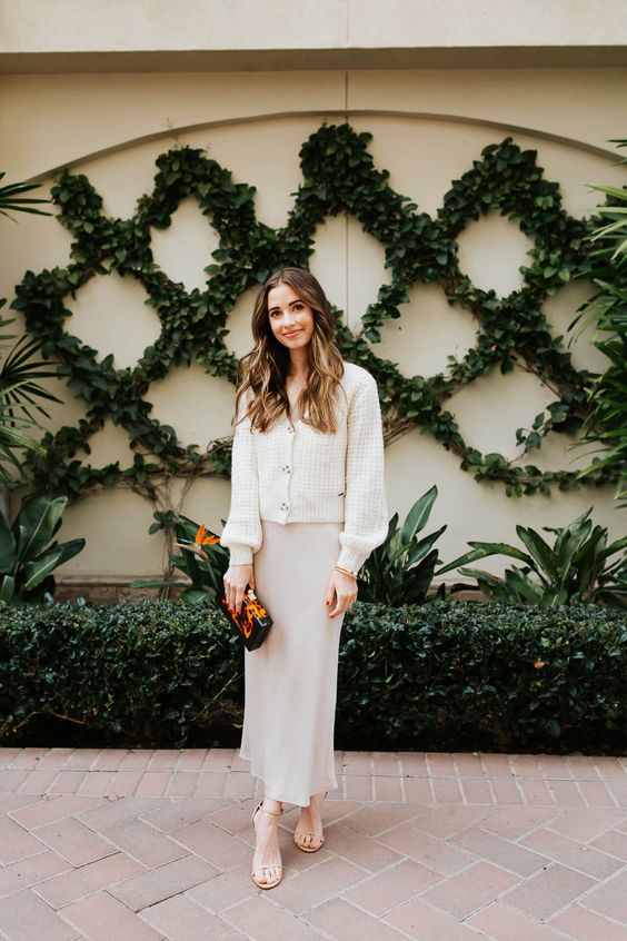 a casual spring bride-to-be look with a cardigan on top a slip dress, nude shoes and a small bag is cool
