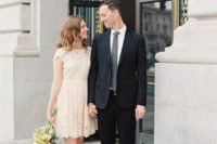 a simple cute lace dress with cap sleeves and a high neckline and matching shoes for a city hall wedding