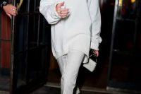 a white oversized sweatshirt, skinny pants, white semi sheer shoes and a mini bag for a lovely fall bridal shower