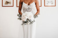 02 The bride looked stunning in her fitting wedding dress with a lace bodice and a sleek skirt with a train
