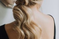 02 a low wavy ponytail with a messy top accented with a cool shiny star headcomb is a gorgeous idea
