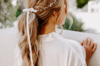 03 The bride was rocking a cute wavy low ponytail accented with a pearl hair vine