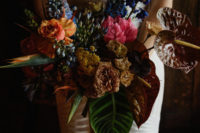 03 The wedding bouquet was done colorful, with bright blooms and large tropical leaves