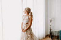 04 The bride was wearing a sleeveless wedding dress with a lace bodice and a floral applique skirt