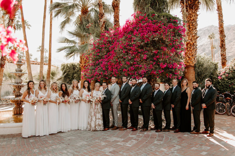 The bridesmaids were wearing white, and the groomsmen were rocking grey