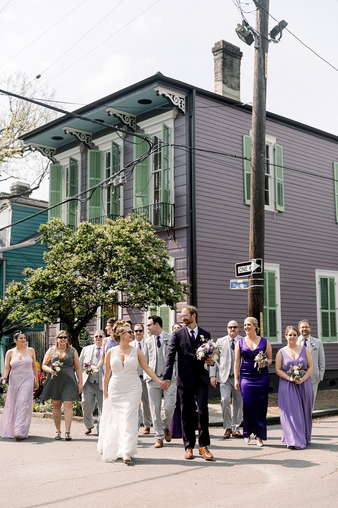 The groomsmen were rocking dove grey three piece suits with purple ties