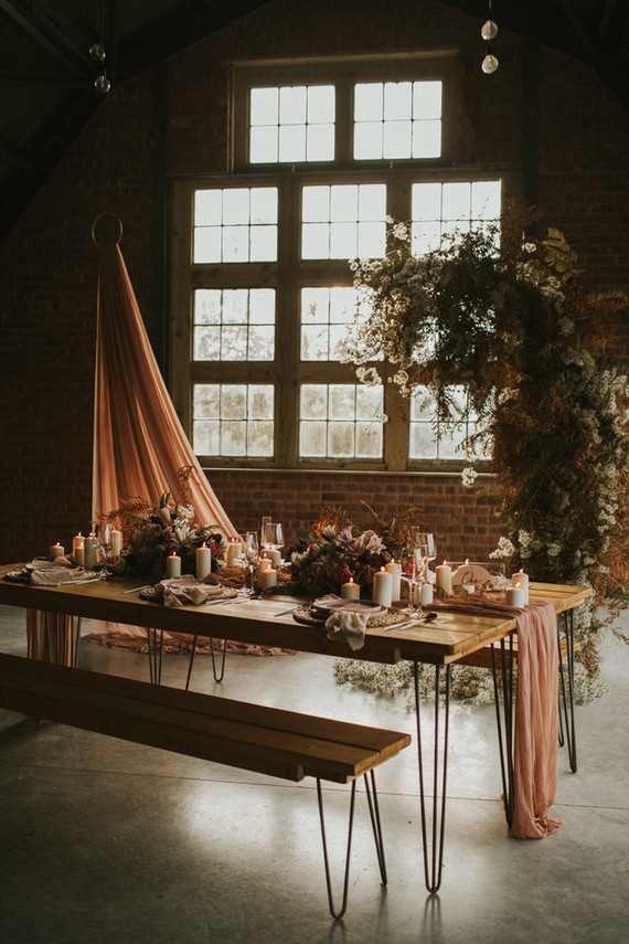 I love the combo of a dried floral semi arch and pink fabric