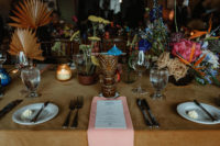 10 The tables were decorated in a whimsy way, with bright blooms, candles, colored fronds and bright napkins
