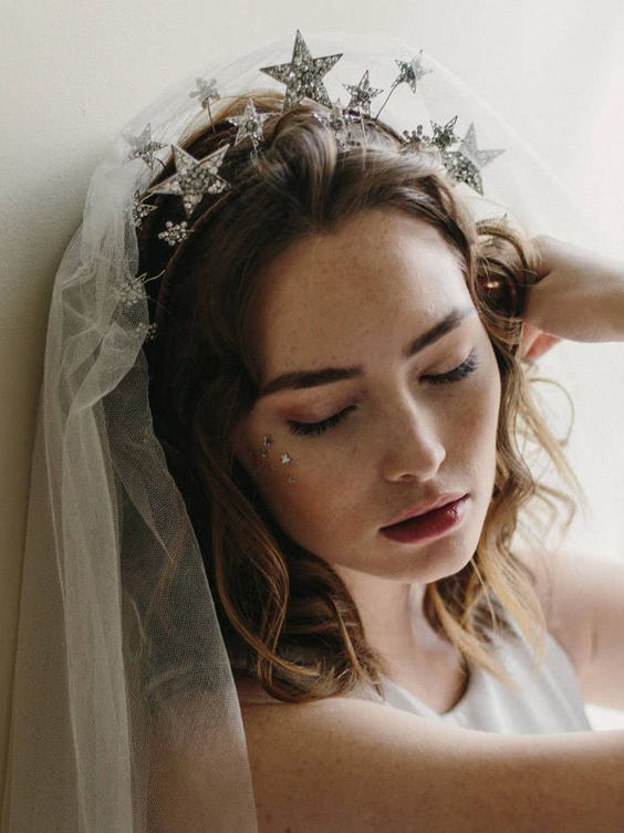 a gorgeous silver rhinestone star headpiece paired with a veil is a perfect idea for a celestial bride