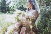 a unique oversized wedding bouquet with pink roses, greenery and smoke bush is a chic and romantic idea