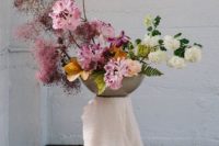 an ikebana-inspired wedding arrangement with pink and white blooms, smoke bush and greenery