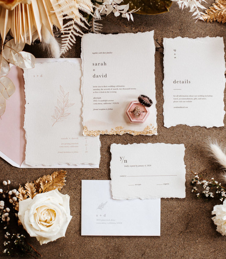 The wedding stationery was done with a raw edge and gold leaf