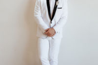 04 The groom was wearing a white tux with black lapels