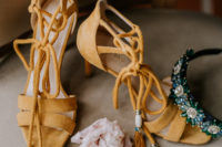 06 She was wearing mustard lace up shoes with tassels, statement earrings and a headpiece