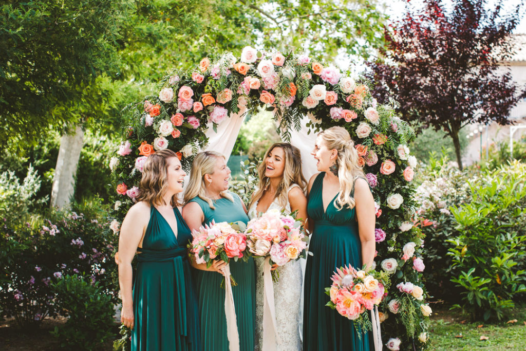 The bridesmaids were wearing green maxi dress with drapings