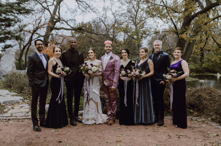 The bridesmaids were wearing mismatching velvet dresses, and the groomsmen were rocking mismatching suits