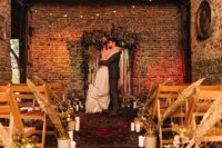 a gorgeous indoor wedding backdrop with ribbons