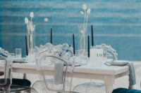 07 The wedding tablescape was done with black candles, dried white blooms and grasses, elegant chairs and grey linens