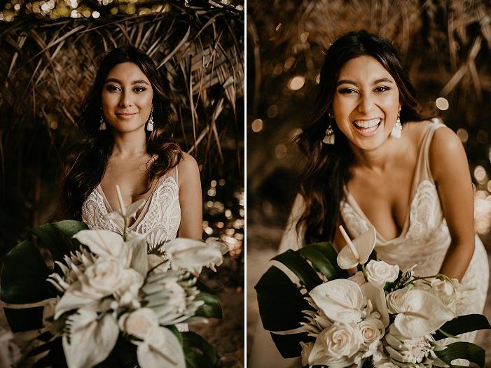 The bride finished off her look with statement earrings and was carrying a white wedding bouquet with tropical blooms and large leaves