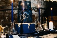 a moody dark blue wedding cake design
