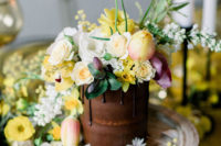 a cute chocolate wedding cake with bold blooms