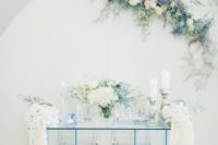11 The sweetheart table was done in icy blue, with lots of blue and white blooms and statement candles