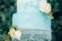 12 The wedding cake was icy blue, with painted and fresh blooms