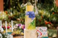 12 The wedding cake was spectacular and bold, with blooms and colorful caramel shards