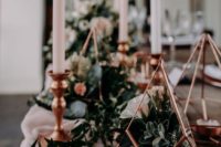 24 wedding decor done with greenery, blush candles and a blush runner, copper terrariums with greenery and succulents