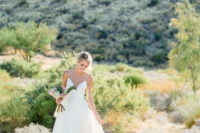 02 The bride was wearing a minimalist A-line wedding dress with a plunging neckline and rocking an updo