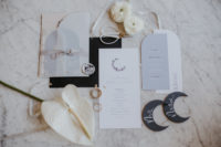 02 The wedding invitation suite was done in neutrals, powder blue and black, with moon decor