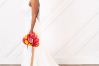 03 The bride was wearing a sheath plain wedding dress with a train and yellow tassel earrings