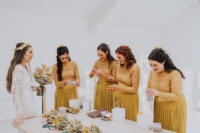 03 The bridesmaids were wearing yellow matching dresses with lace bodices and pleated skirts