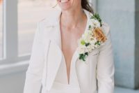 04 The second bride was wearing a more rock look with a white jumpsuit, a white moto jacket and a lush floral boutonniere