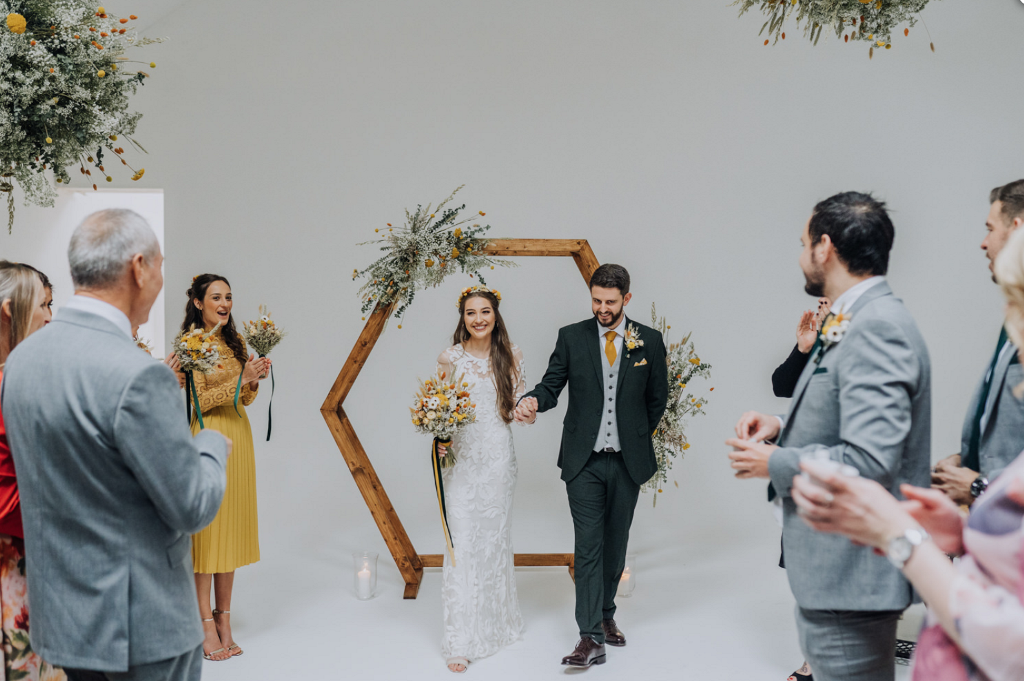 The wedding arch was hexagonal and it was built by the father of the bride