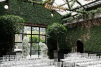 05 The wedding ceremony space was done with lots of greenery, chandeliers, a baby’s breath altar and white chairs