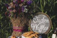 05 a rustic chicken and waffle bar with a chalkboard sign, bright blooms, lots of waffles and chicken served