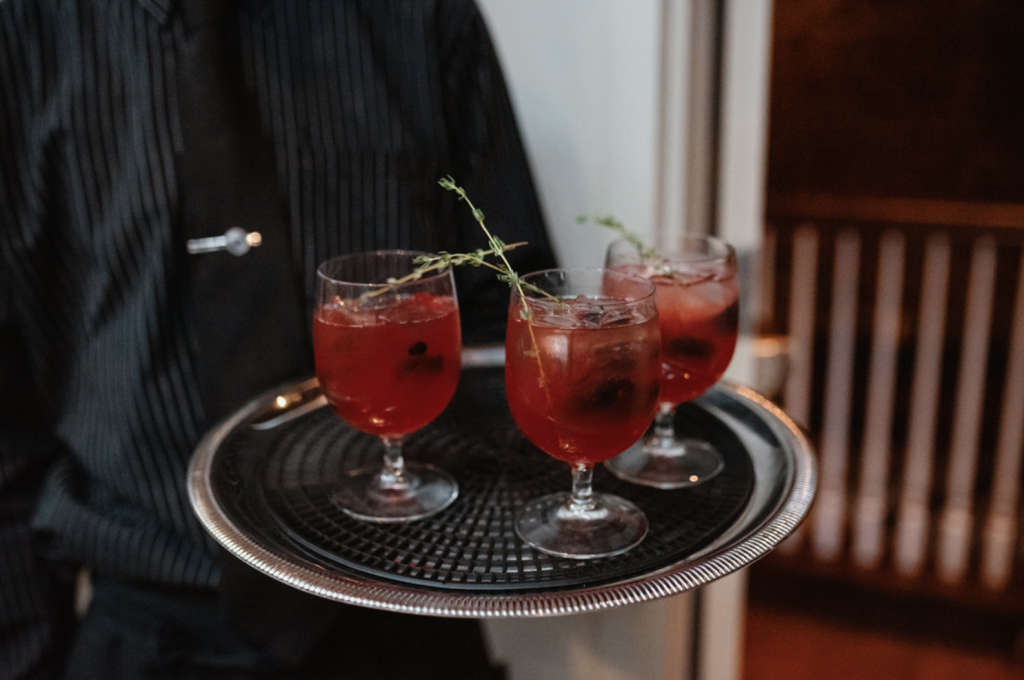 Delicious cocktails were styled for this dark-themed wedding