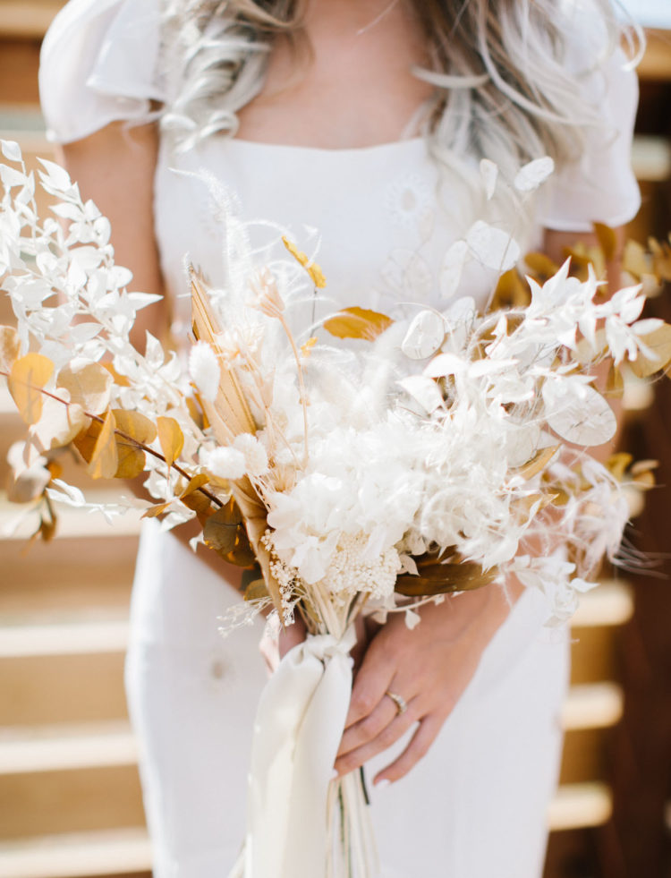 The wedding bouquet was composed of dried blooms and foliage