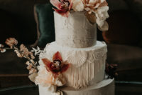 08 The wedding cake was a white textural one, with macrame and blush and bold blooms