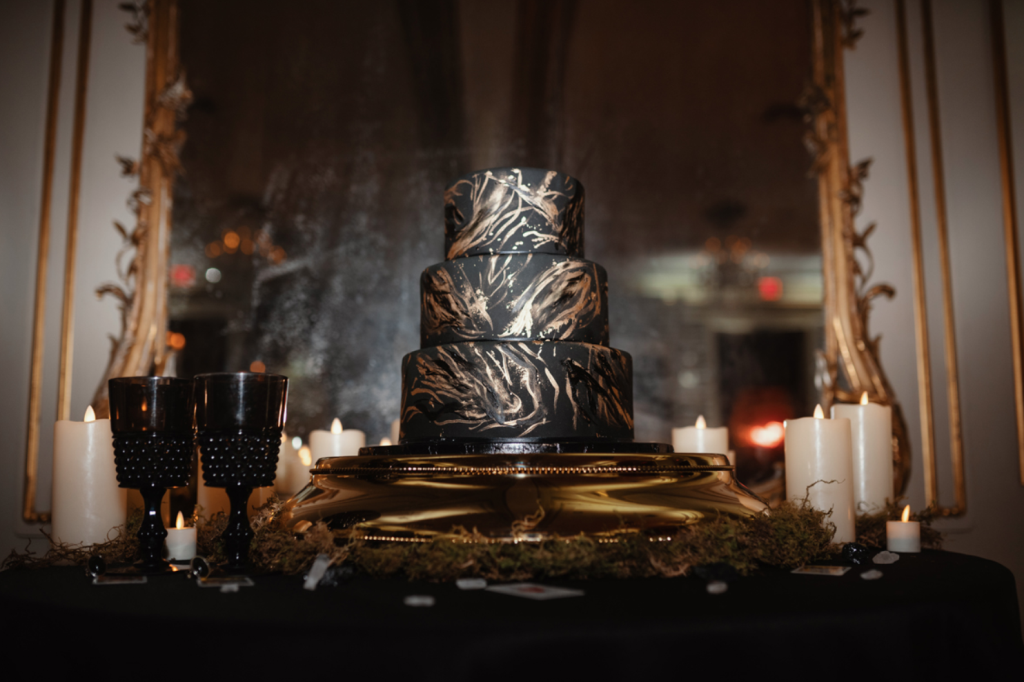 The wedding cake was a black one decorated with gold brushstrokes