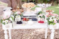 14 an elegant vintage waffle bar with a white vintage table, pink and white blooms, greenery, waffles, toppings and sauces
