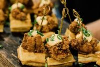 18 chicken and waffle appetizers topped with mayo and green onion are a delicious idea