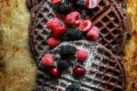 19 chocolate waffles with sugar powder, rapsberries, cherries and blackberries are delicious